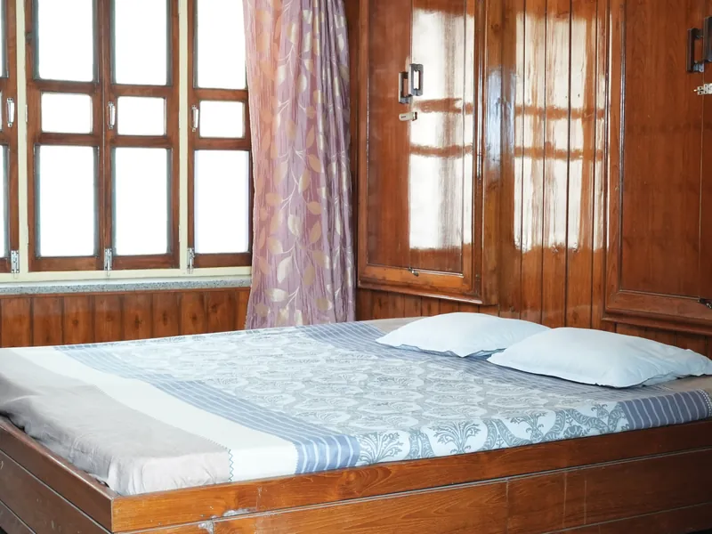Guest room with a double bed and fresh linen