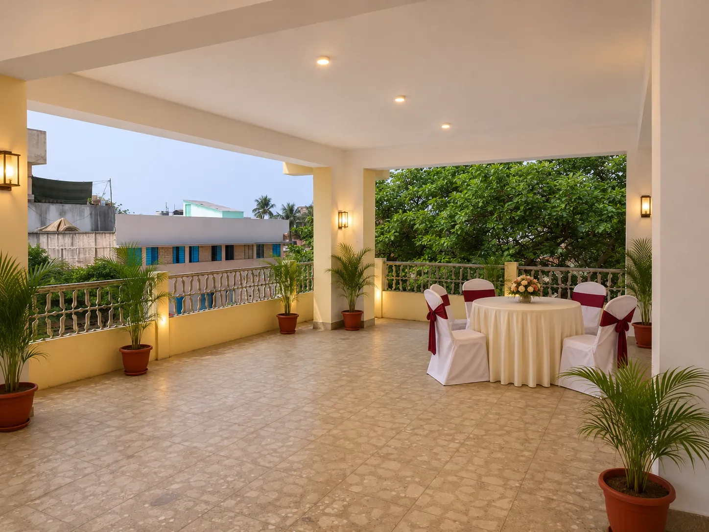The covered terrace with seating and greenery